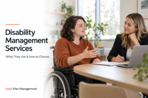 Woman using a wheelchair discussing disability support options with an adviser.